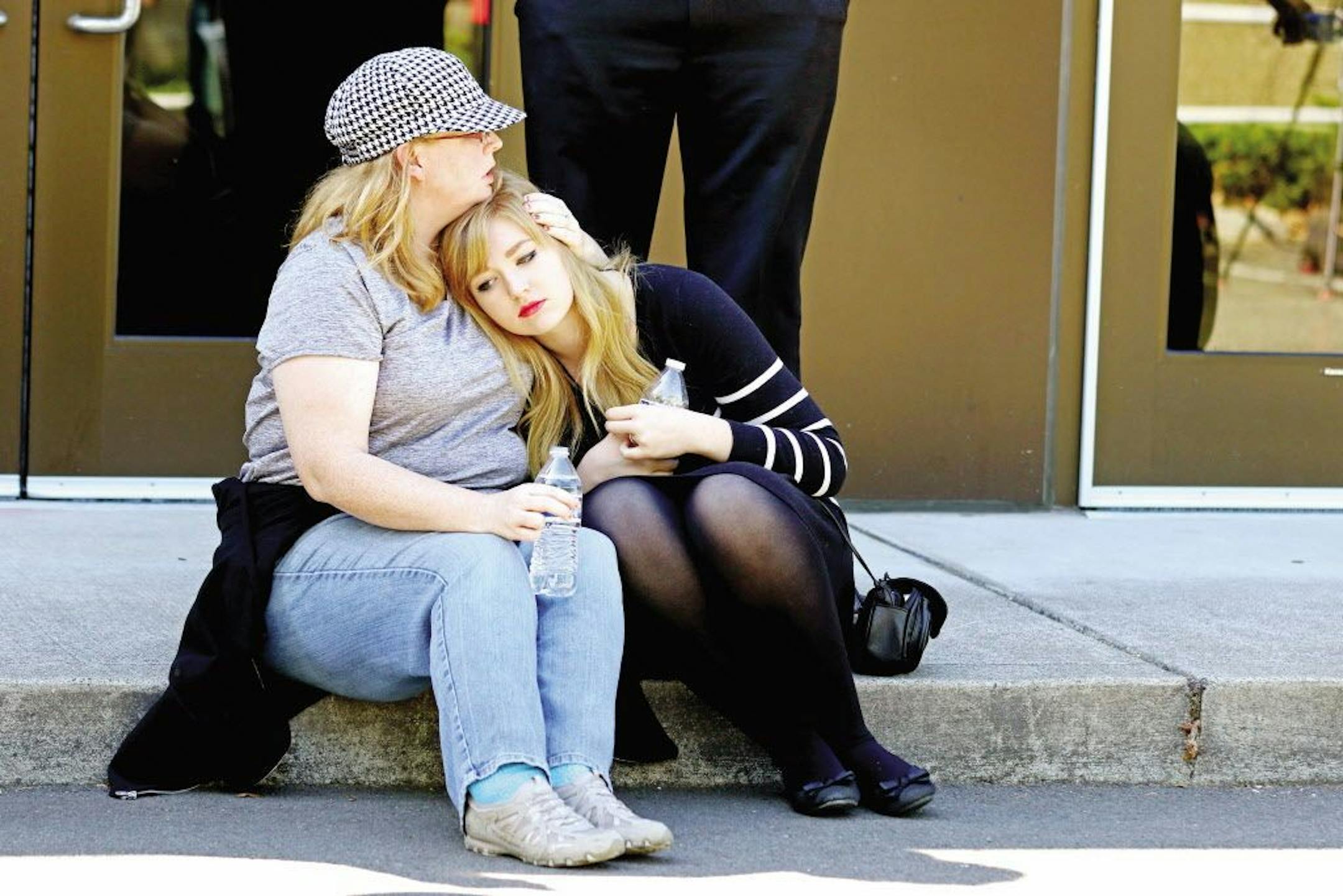 Friends and family are reunited with students at the local fairgrounds after a deadly shooting at Umpqua Community College, in Roseburg, Ore., Thursday, Oct. 1, 2015.