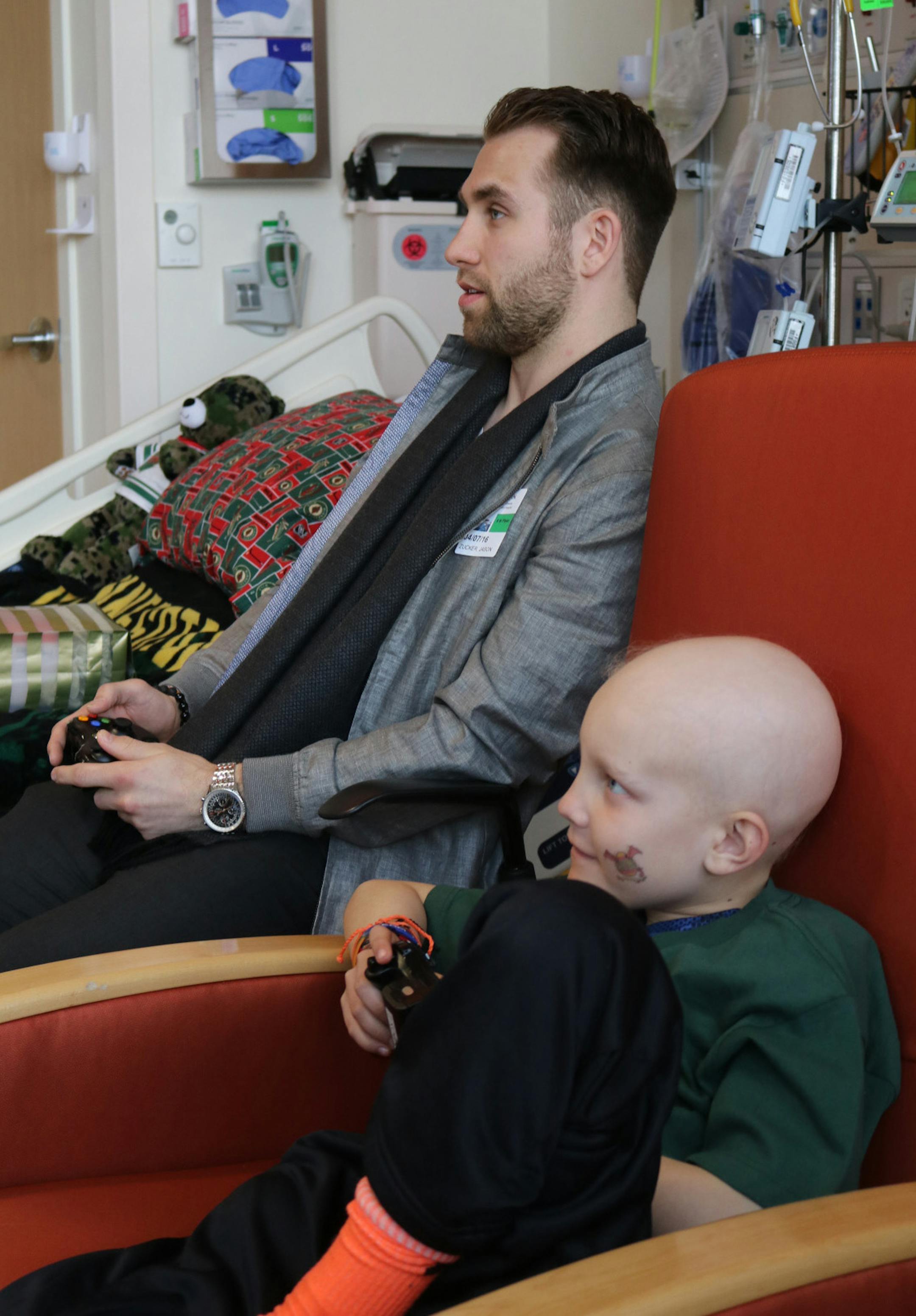 Jason Zucker and his young friend Tucker Helstrom, who died earlier this month.