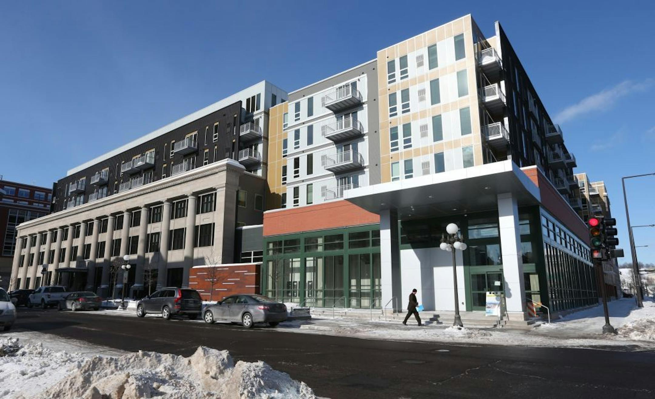 St. Paul's Penfield apartments, seen on opening day in 2014, was a controversial project when it opened. Now city officials are considering sale of the luxury-apartment complex at a profit.