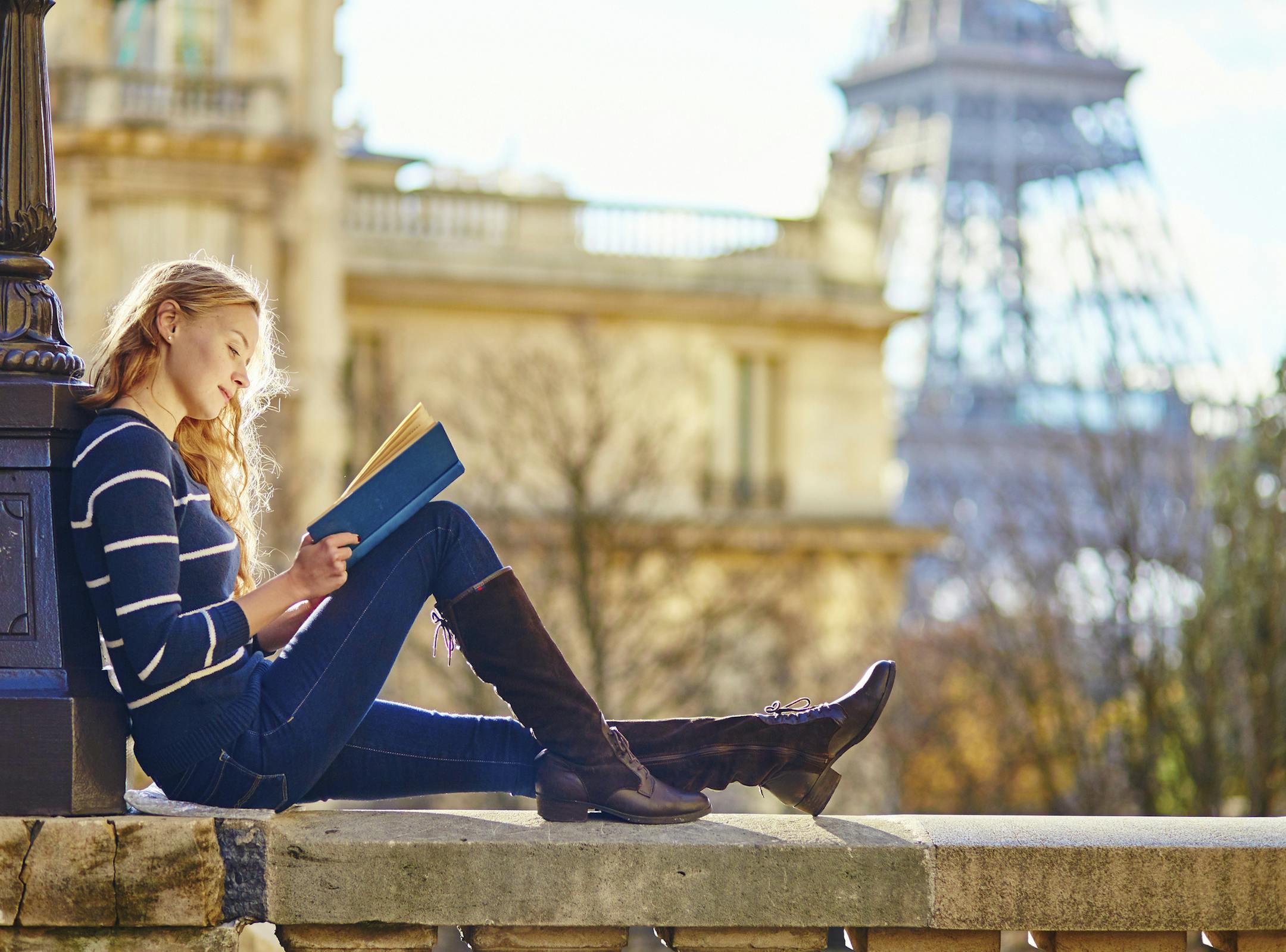 Is she reading "Suite Francaise"? Or "A Moveable Feast"?