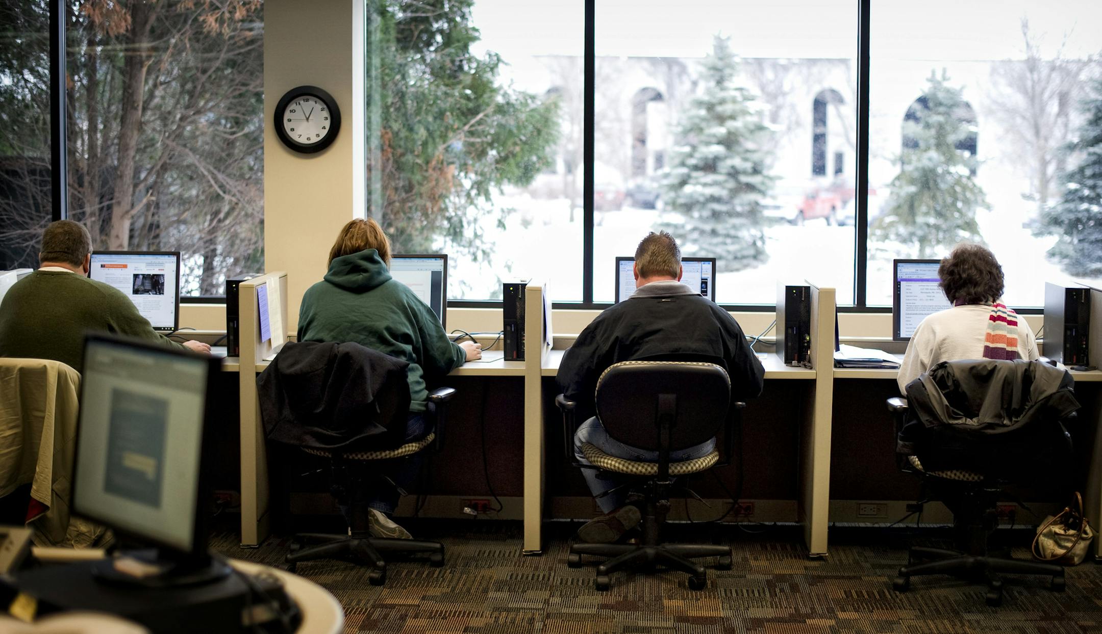 People looked for job leads at the Minnesota Workforce Center in Brooklyn Park.