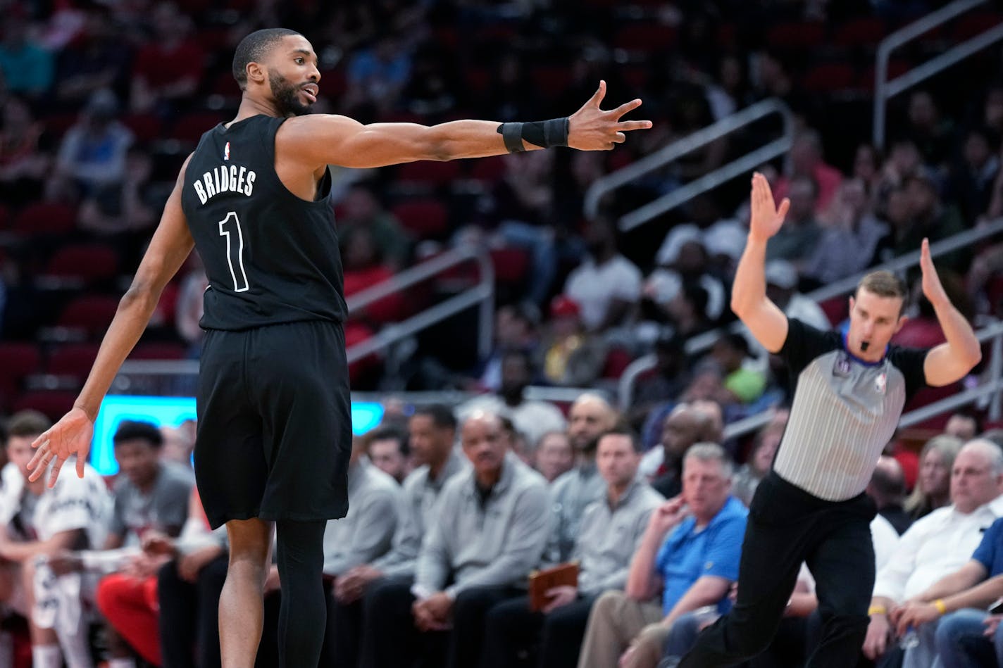 Brooklyn Nets forward Mikal Bridges (1) reacts after making a 3-point basket during the second half of the team's NBA basketball game against the Houston Rockets, Tuesday, March 7, 2023, in Houston. (AP Photo/Eric Christian Smith)