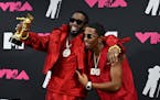 Sean "Diddy" Combs, left, and his son, Christian "King" Combs, pose with the Global Icon award in the press room during the MTV Video Music Awards at 