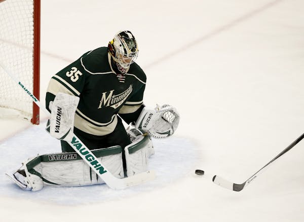 Minnesota Wild goalie Darcy Kuemper (35) deflected the puck in the first period.