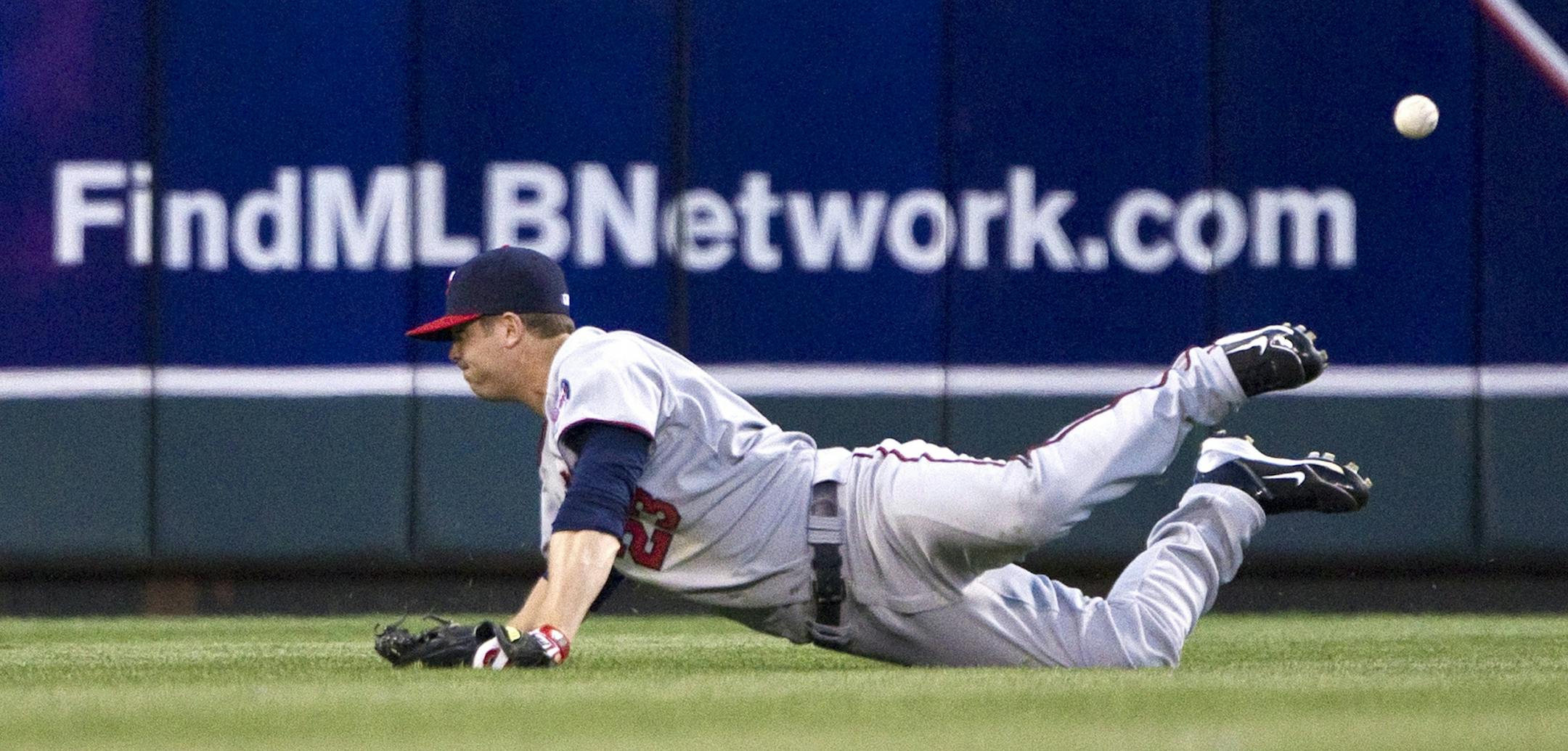 Minnesota Twins right fielder Rene Tosoni can't get to a triple hit by the Kansas City Royals' Chris Getz in the seventh inning at Kauffman Stadium in Kansas City, Missouri, Saturday, April 30, 2011.