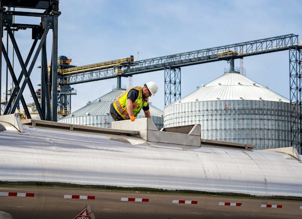 An employee worked atop a vat of industrial ethanol at Al-Corn Clean Fuel ethanol plant in Claremont, Minn. 