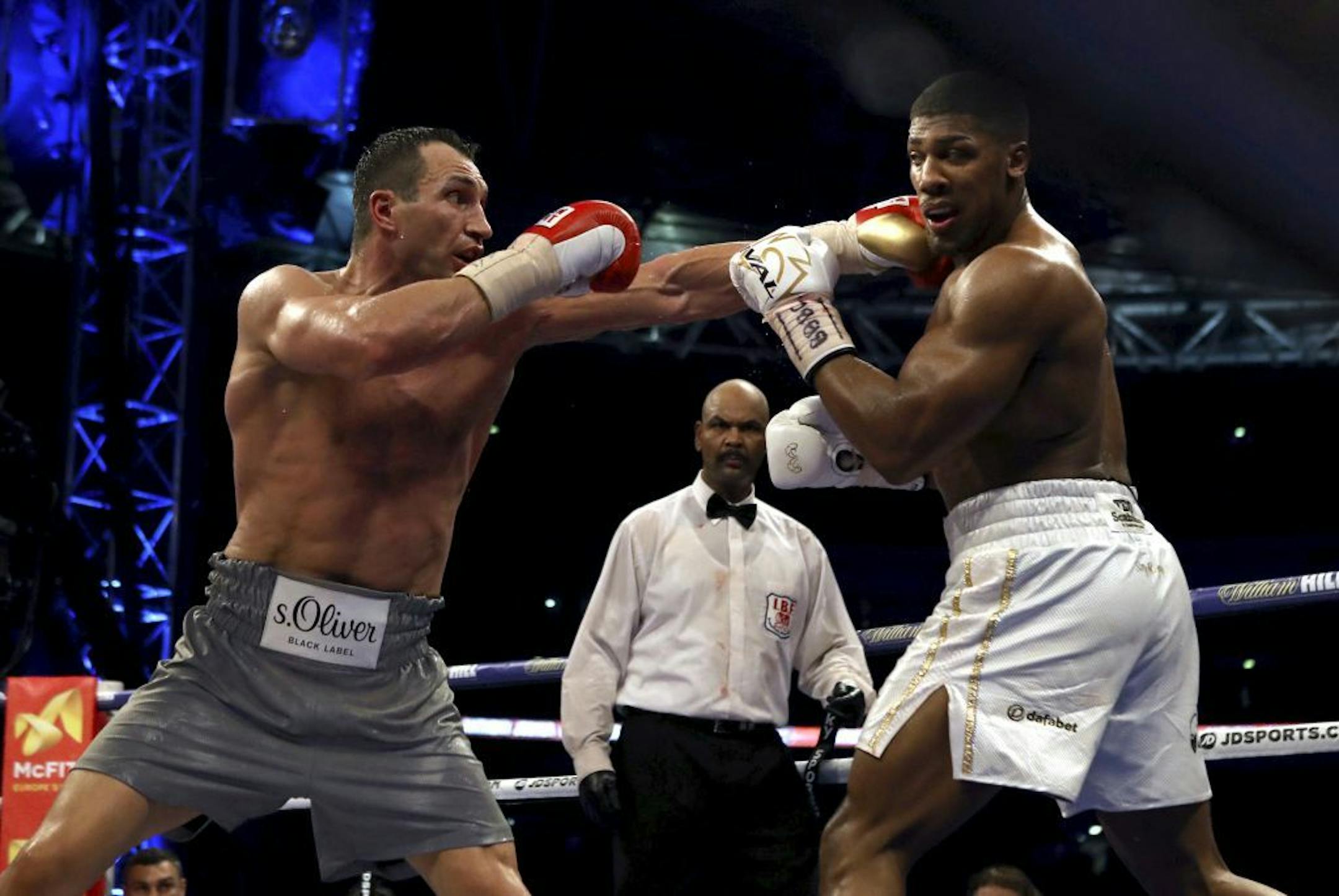 British boxer Anthony Joshua, right, Ukrainian boxer Wladimir Klitschko during their fight for Joshua's IBF and the vacant WBA Super World and IBO heavyweight titles, at Wembley Stadium, in London, Saturday, April 29, 2017.