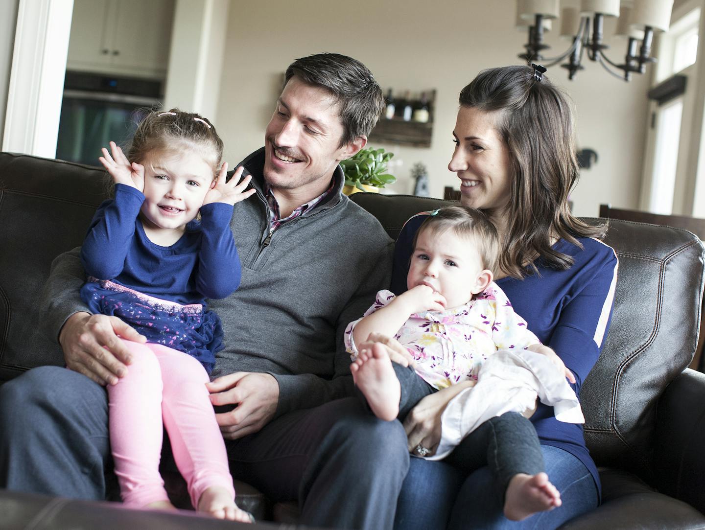 Minnesota Wild's Ryan Carter poses for a family photo with wife Erin and daughters Maggie, 3, left, and Natalie, 15 months, at their home in Gem Lake November 22, 2015. (Courtney Perry/Special to the Star Tribune)