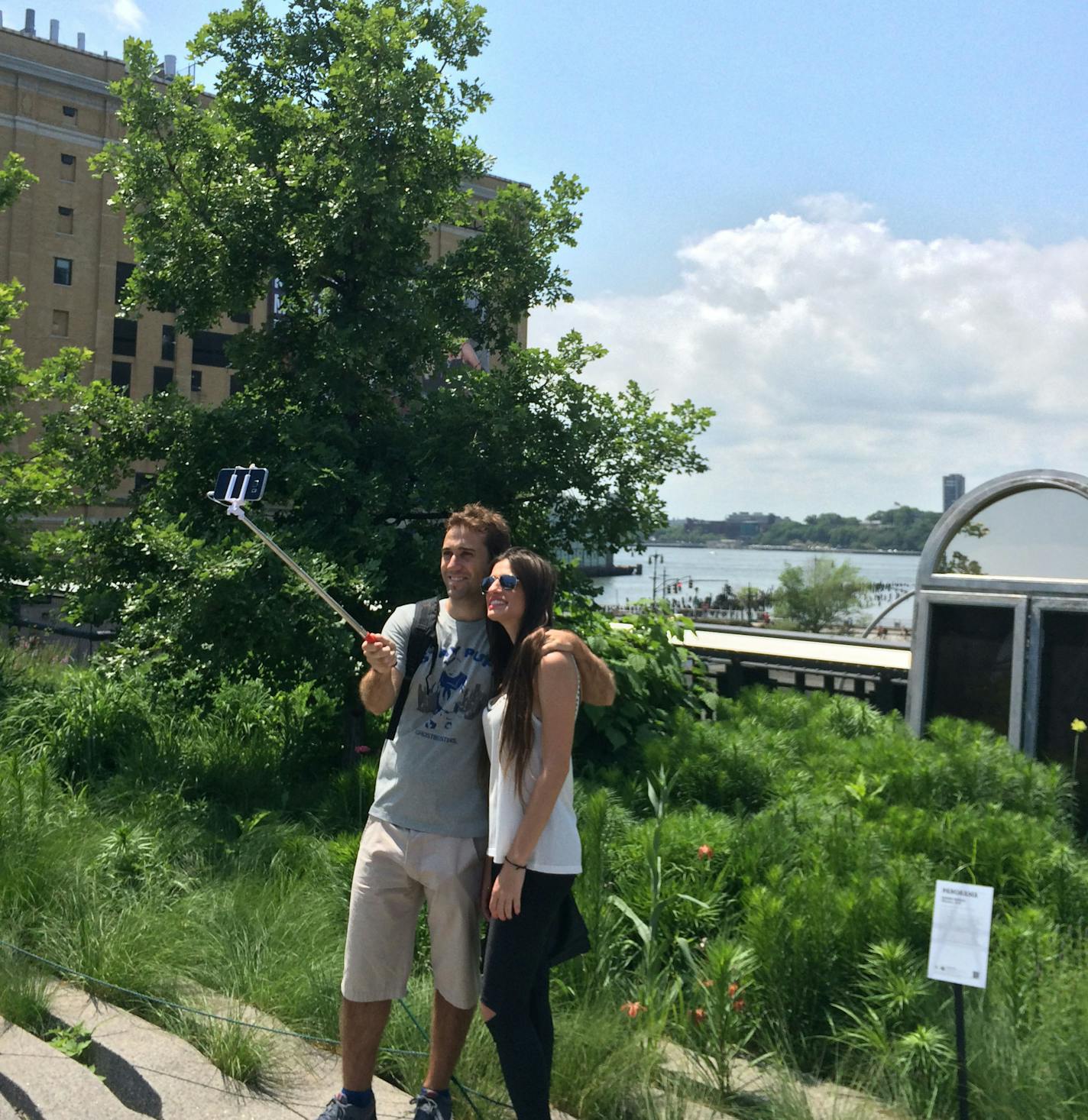 A young couple used a selfie stick to capture a moment on the High Line in New York City. credit: Gail Rosenblum, Star Tribune