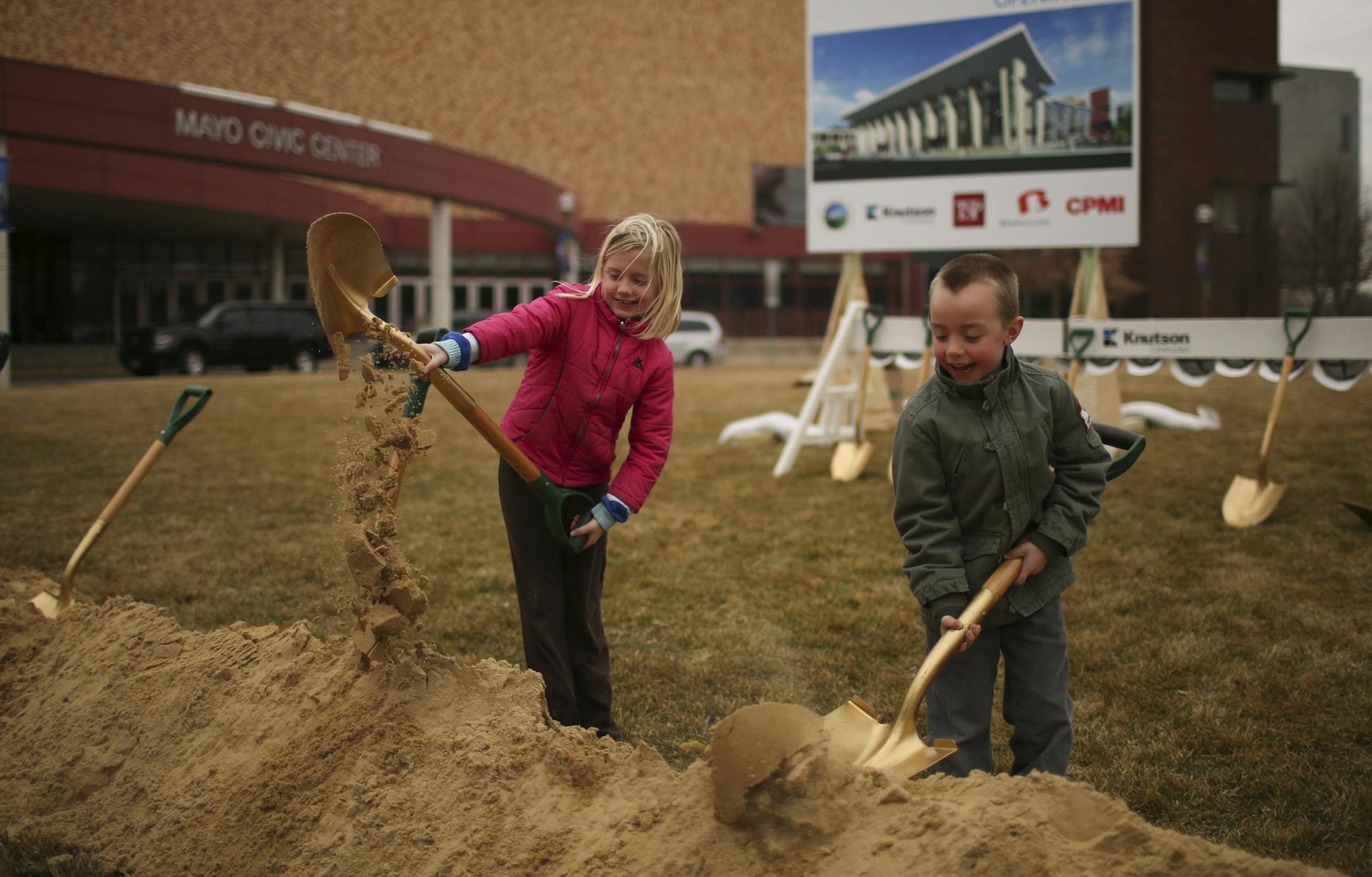 After the officials were through with the groundbreaking, Vivian Hatlevig,8, and her brother, Eli, 6, took a turn Thursday afternoon in Rochester. ] JEFF WHEELER ï jeff.wheeler@startribune.com A ceremonial groundbreaking was held Thursday afternoon in Rochester March 19, 2015 for the $85 million Mayo Civic Center expansion and renovation.