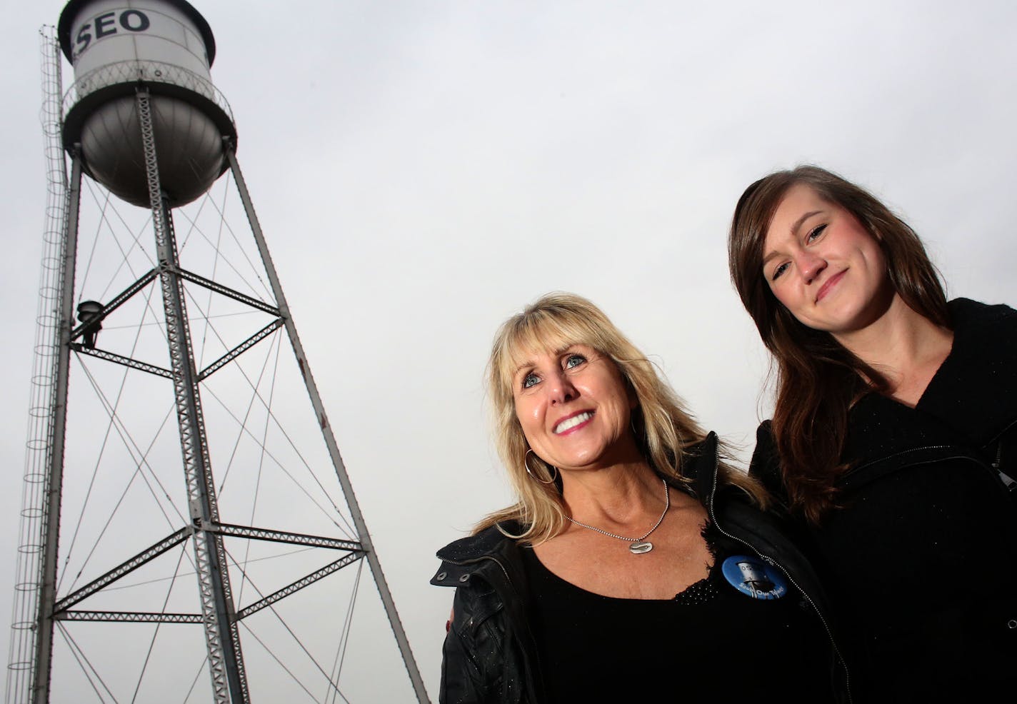 Kathleen Gette and her daughter Lauren Bowe stood near Osseo&#x2019;s water tower, which Gette helped save from teardown after the city learned the cost of restoring it would run $300,000 to $500,000.