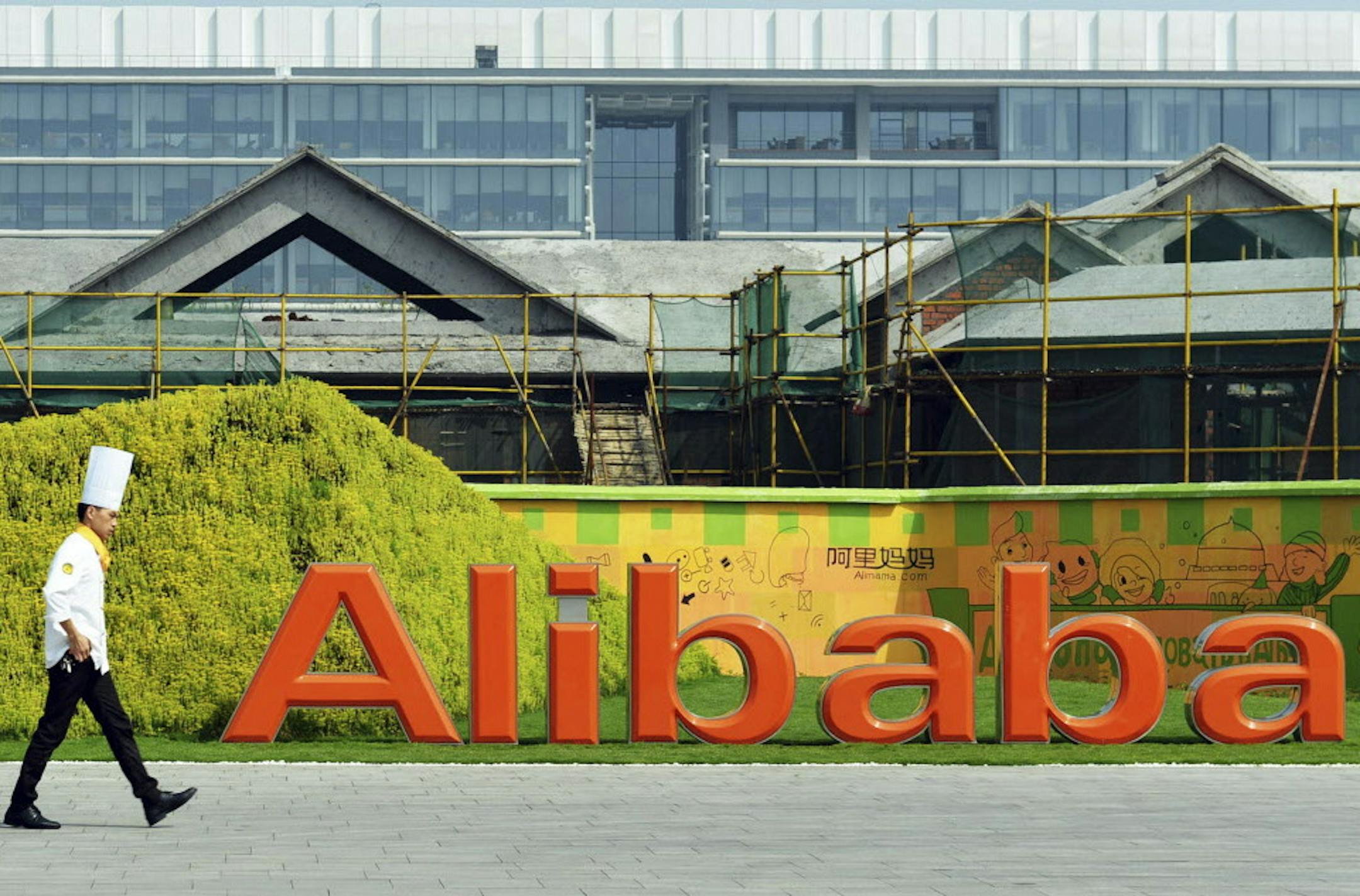 In this photo taken on Aug. 27, 2014, a chef walks in the headquarter campus of Alibaba Group in Hangzhou in eastern China's Zhejiang province Foreigners who want to buy Alibaba Group shares in the Chinese e-commerce giantís U.S. public offering will need to get comfortable with an unusual business structure.(AP Photo) CHINA OUT