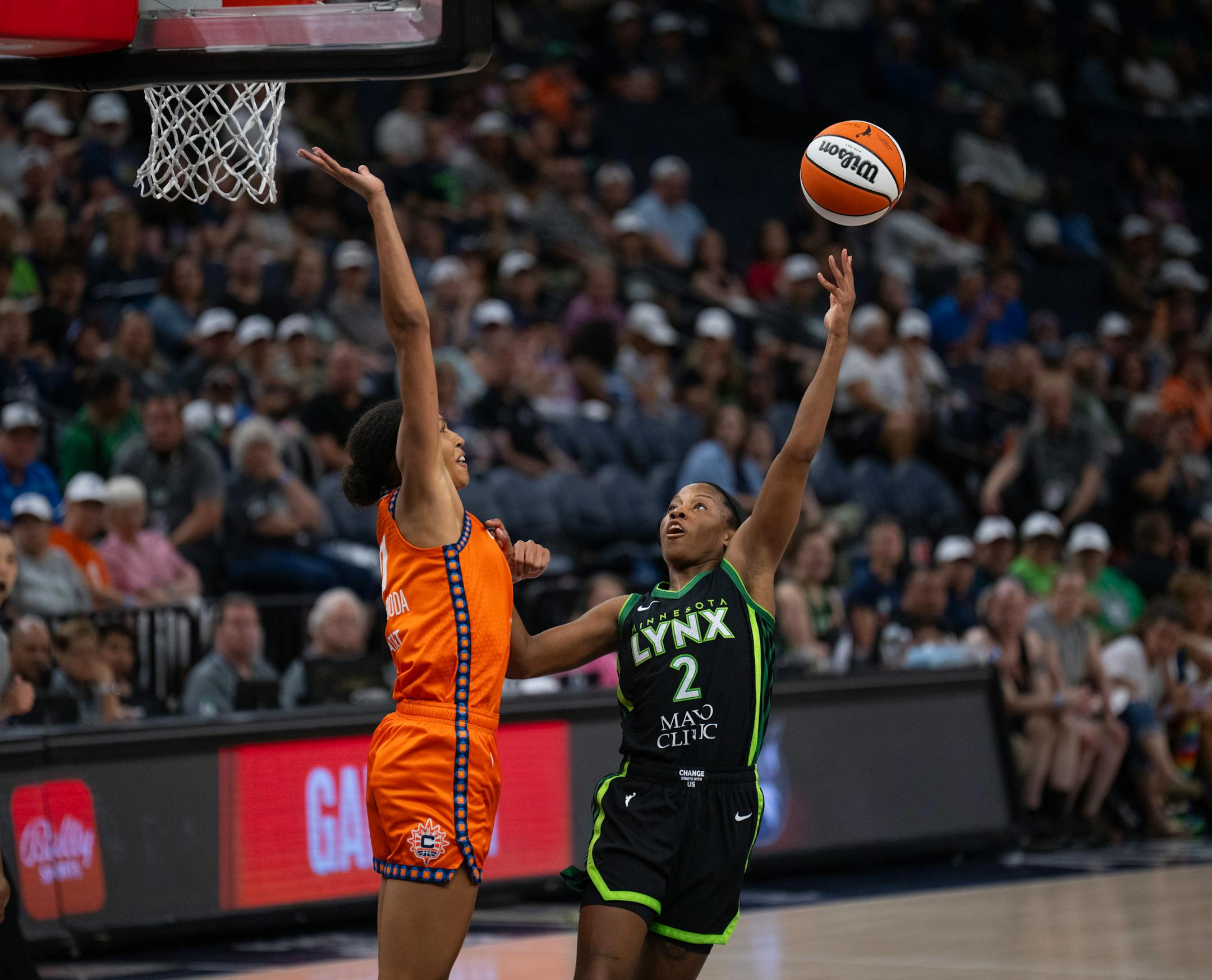 Minnesota Lynx guard Lindsay Allen (2) put up a shot over Connecticut Sun forward Olivia Nelson-Ododa (10) in the fourth quarter Thursday night. The Minnesota Lynx lost to the Connecticut Sun 89-68 in a WNBA game Thursday night, June 22, 2023 at Target Center in Minneapolis.