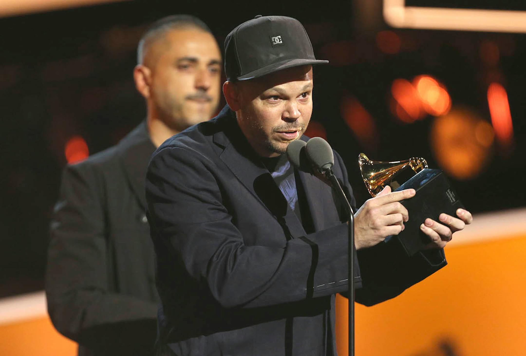 Residente accepts the best Latin rock, urban or alternative album for "Residente" at the 60th annual Grammy Awards at Madison Square Garden on Sunday, Jan. 28, 2018, in New York.