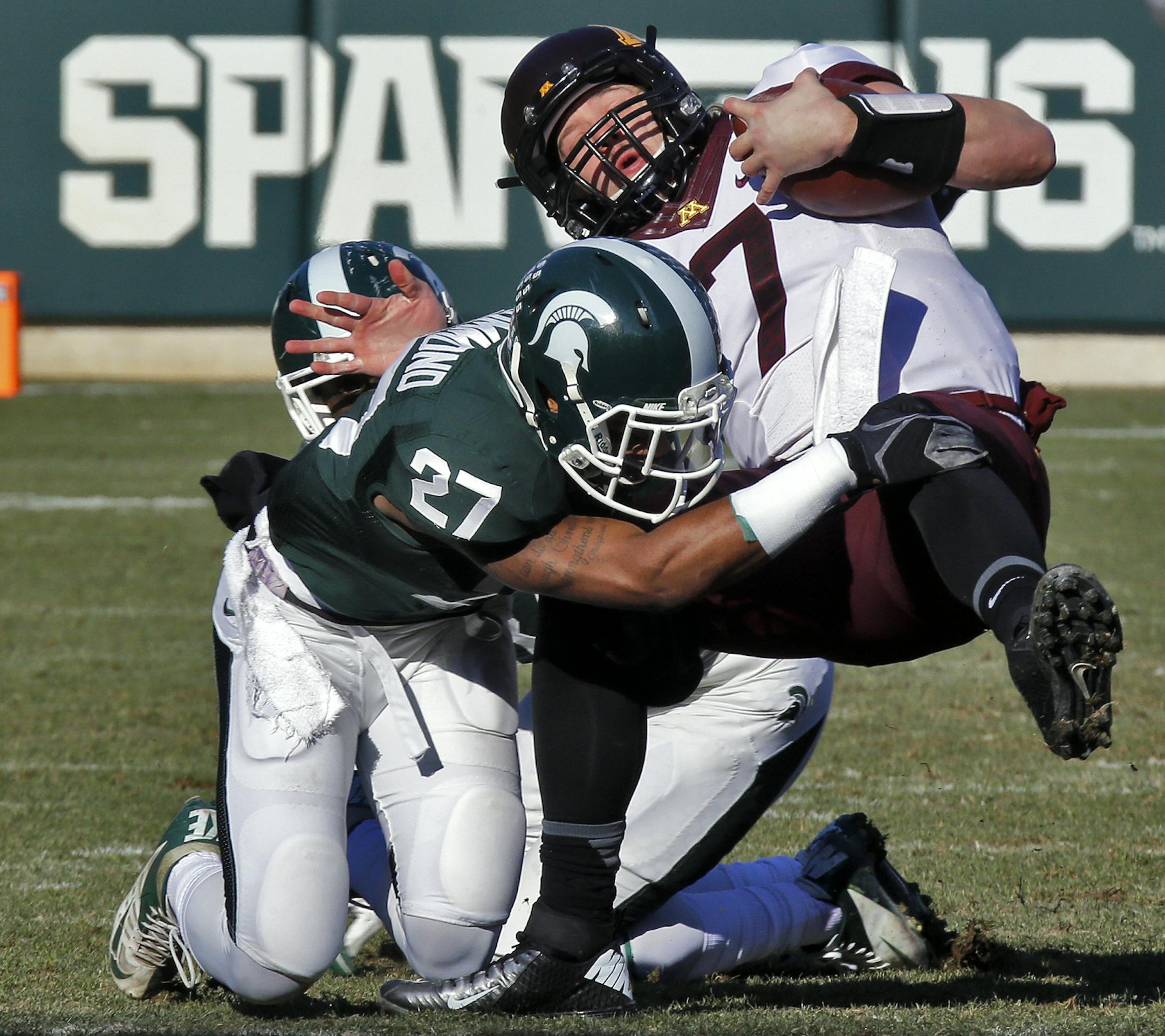 Minnesota Gophers vs. Michigan State Spartans. Michigan State won 14-3. Gophers quarterback Mitch Leidner was thrown for a loss by Spartans defender Kurtis Drummond (27) in first half action. (MARLIN LEVISON/STARTRIBUNE(mlevison@startribune.com)