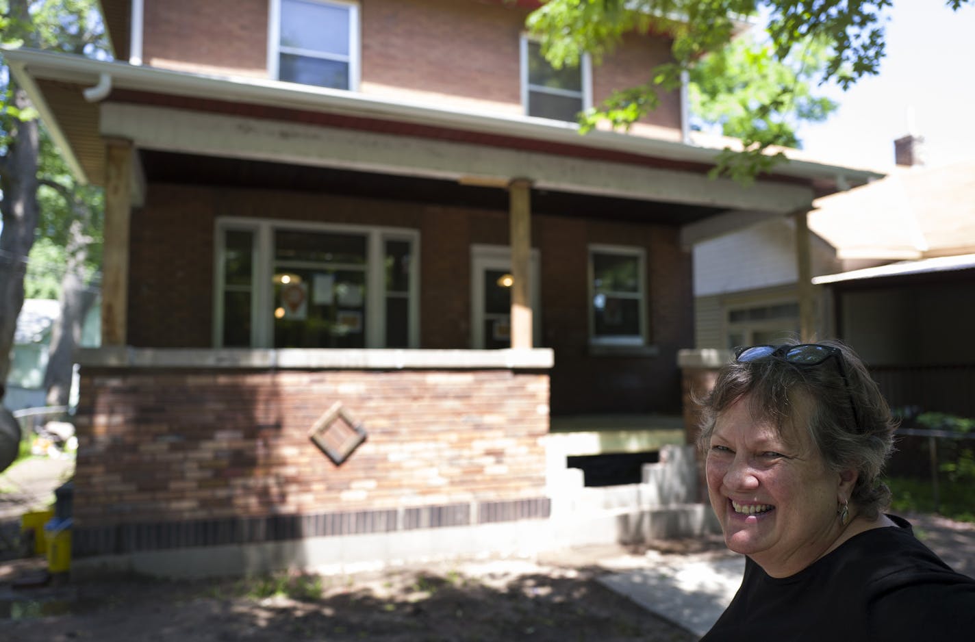 Carol Carey stood in front of a 1,600-sq-ft single-family home located at 493 Edmund Avenue Thursday June 16, 2016 in St. Paul, MN.] This house is the most recent project of Preserve Frogtown a partnership of Frogtown Neighborhood and historic Saint Paul. Jerry Holt /Jerry.Holt@Startribune.com