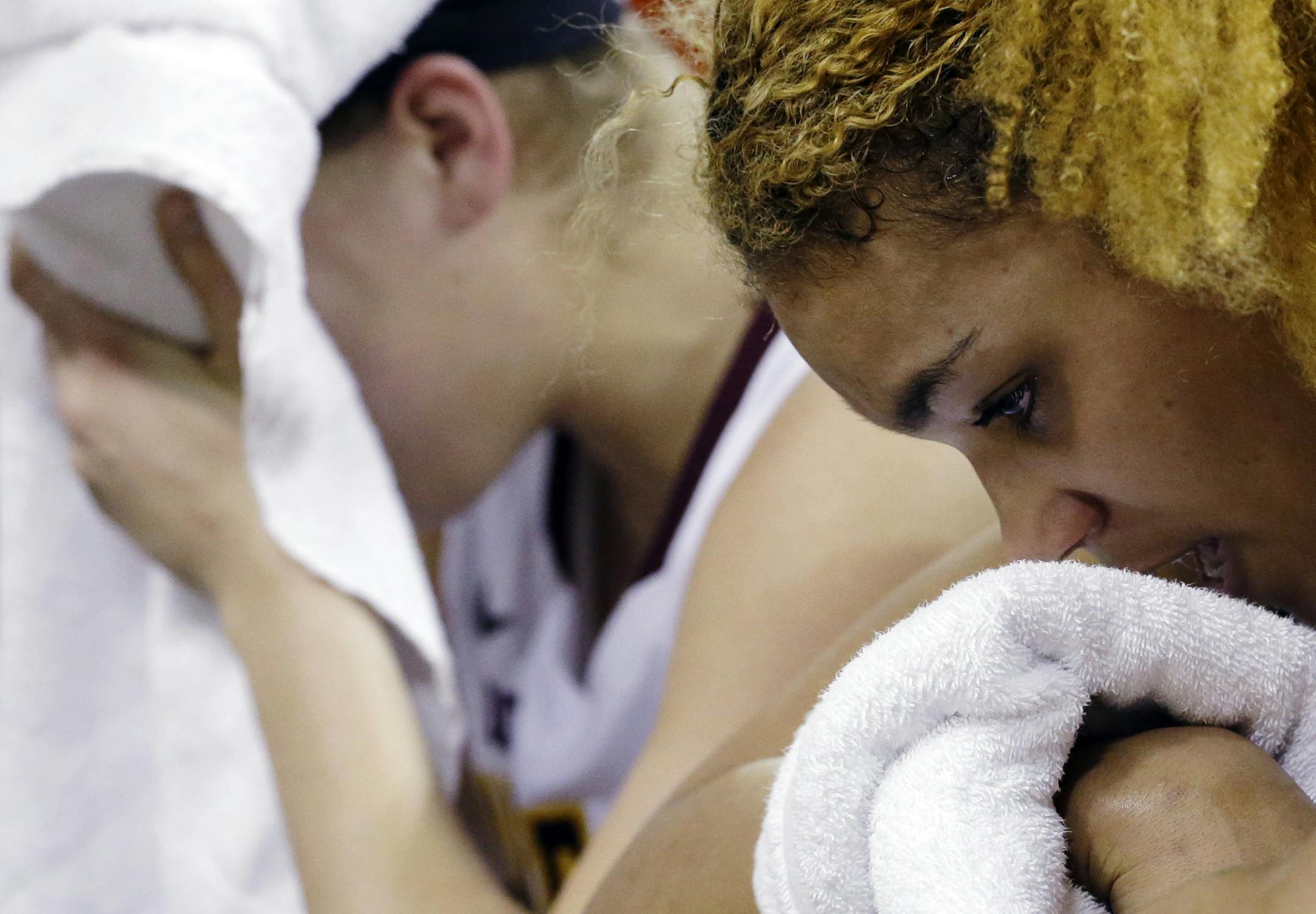 Minnesota forward Micaella Riche, right, and guard Rachel Banham react on the bench during the second half of an NCAA college basketball game against Ohio State in the Big Ten Conference tournament in Hoffman Estates, Ill., Thursday, March 7, 2013. Ohio State won 58-47. (AP Photo/Nam Y. Huh) ORG XMIT: MIN2013030720235394