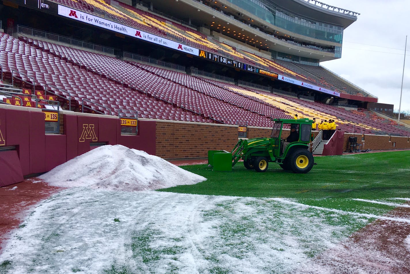 A thin layer of icy snow was scraped from the field Saturday before the Gophers home game vs. Northwestern.