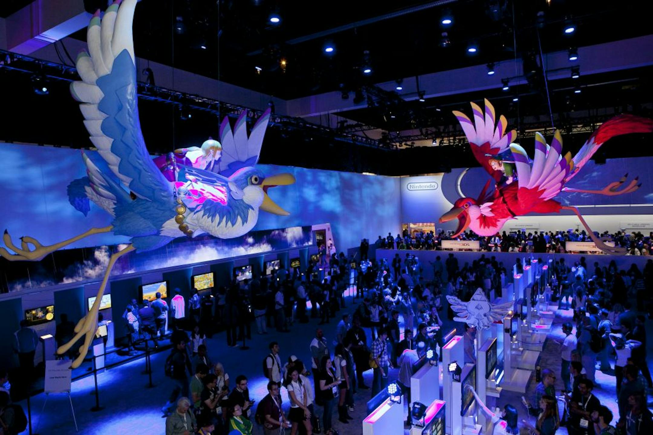Attendees visit the Nintendo booth at the 2011 Electronic Entertainment Expo in Los Angeles, Wednesday, June 8, 2011.