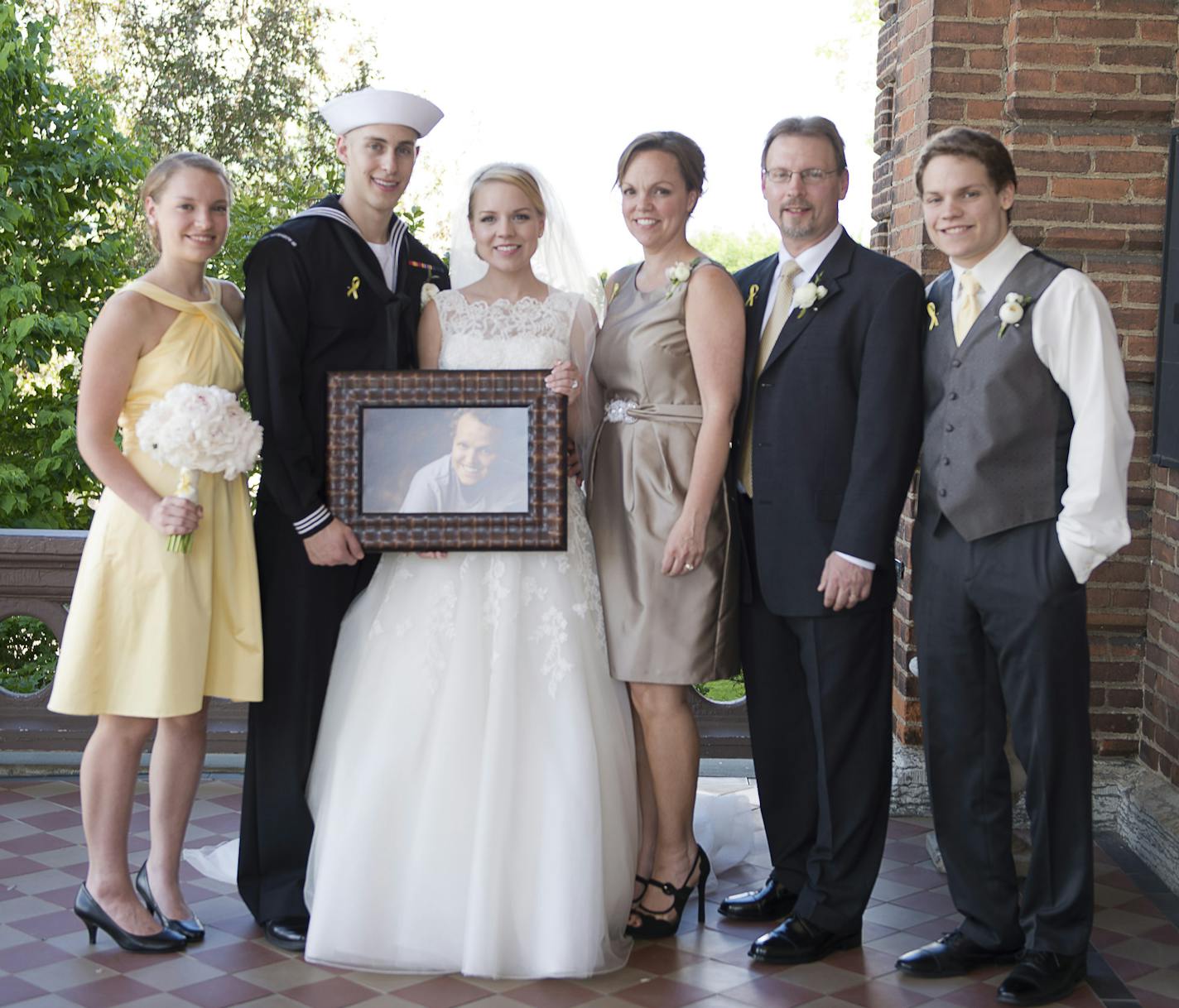 Here&#x201a;&#xc4;&#xf4;s the photo we requested from &#x201a;&#xc4;&#xfa;Fly a Little Higher.&#x201a;&#xc4;&#xf9; The photo should be credited to PeggySue Imihy of PeggySue Photography For cutline info: A week after Zach died, his older sister, Alli, got married. The Sobiech family (including Zach via a photo) posed for the wedding photographer.