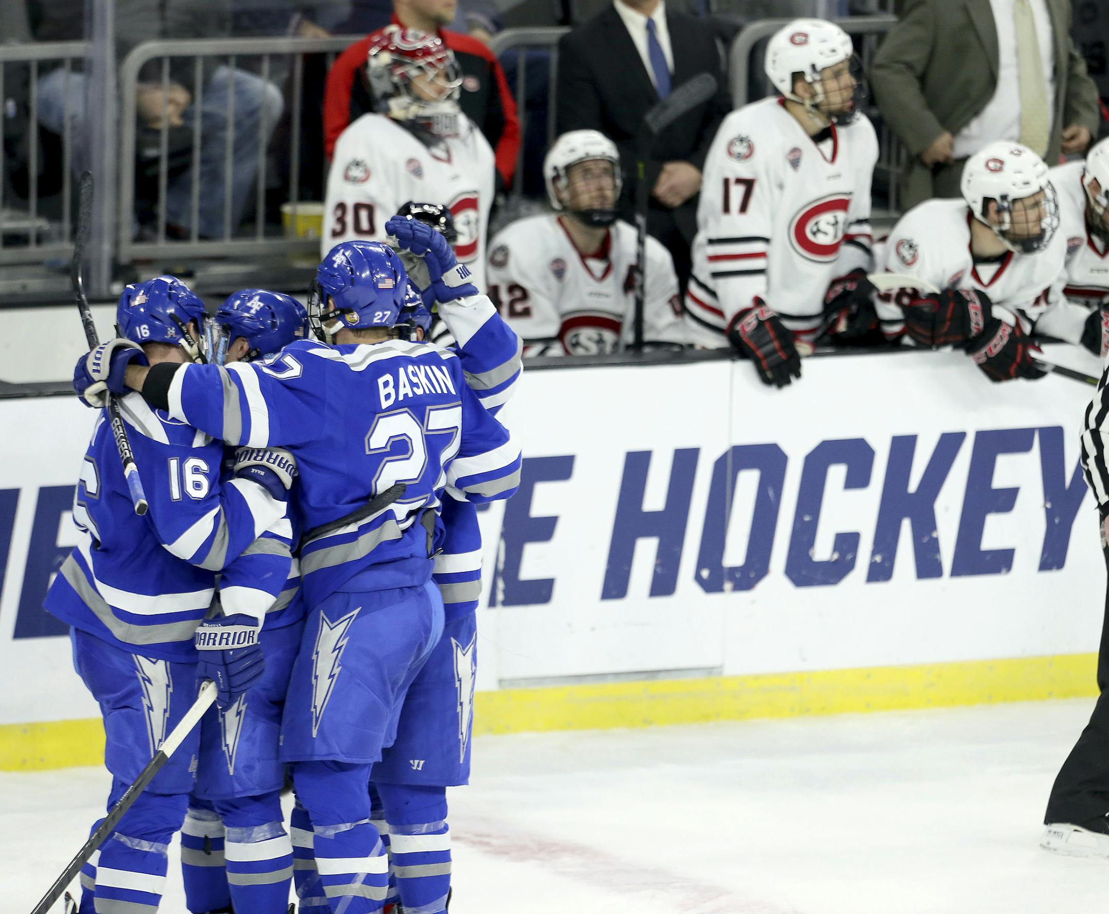 Air Force celebrates an empty-net goal in the closing minute of an NCAA regional men's college hockey tournament game against St. Cloud State University during the third period Friday, March 23, 2018, in Sioux Falls, S.D. (AP Photo/Dave Eggen)