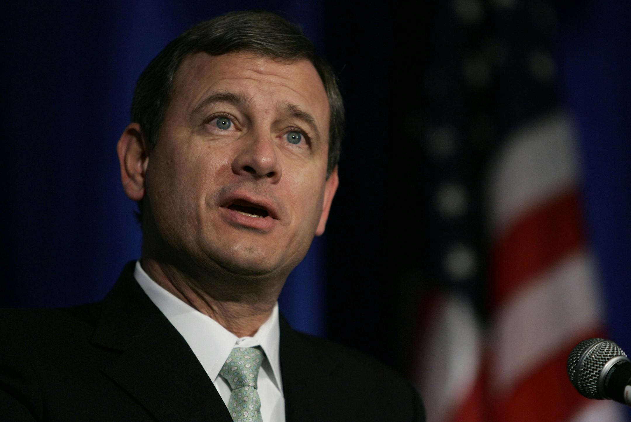Supreme Court Chief Justice John Roberts pauses during a speech to the Federalist Society 25th anniversary celebration Friday, November 16, 2007 in Washington. (AP Photo/Evan Vucci) ORG XMIT: DCEV110