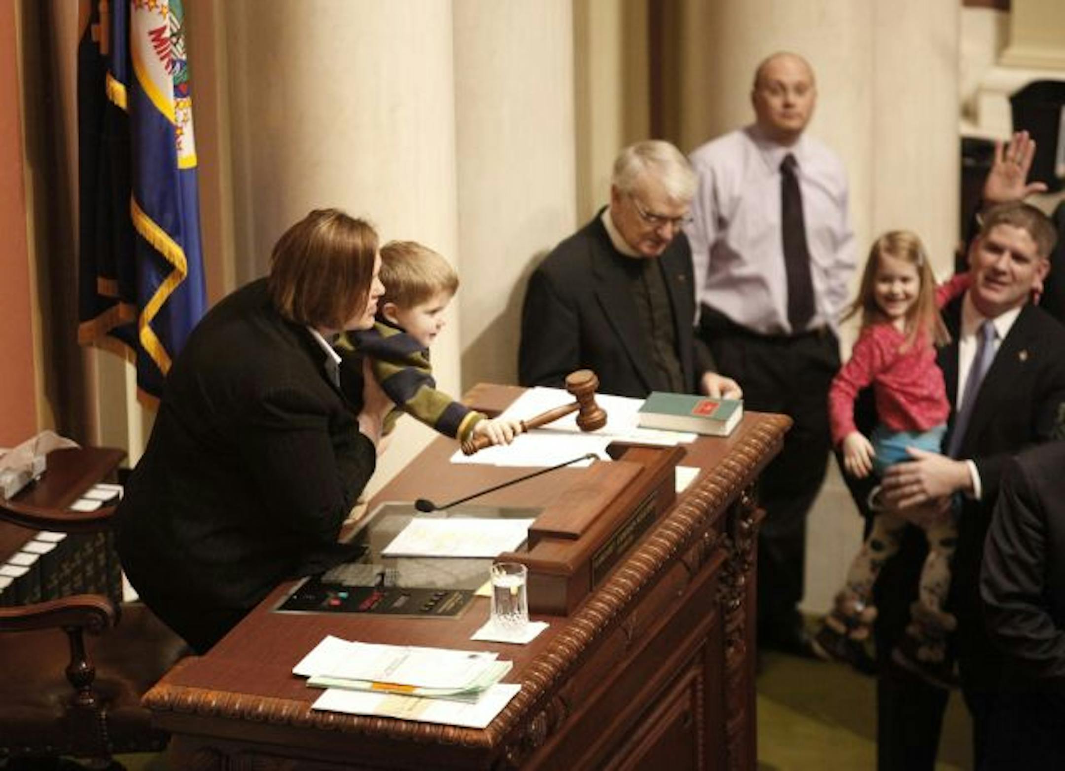 Minnesota House of Representatives Minority Leader Kurt Zellers held his daughter Reagan, 5, as his 3-year-old son Will helped House Majority leader Margaret Anderson Kelliher tap the gavel Thursday at the start of the 2010 legislative session.