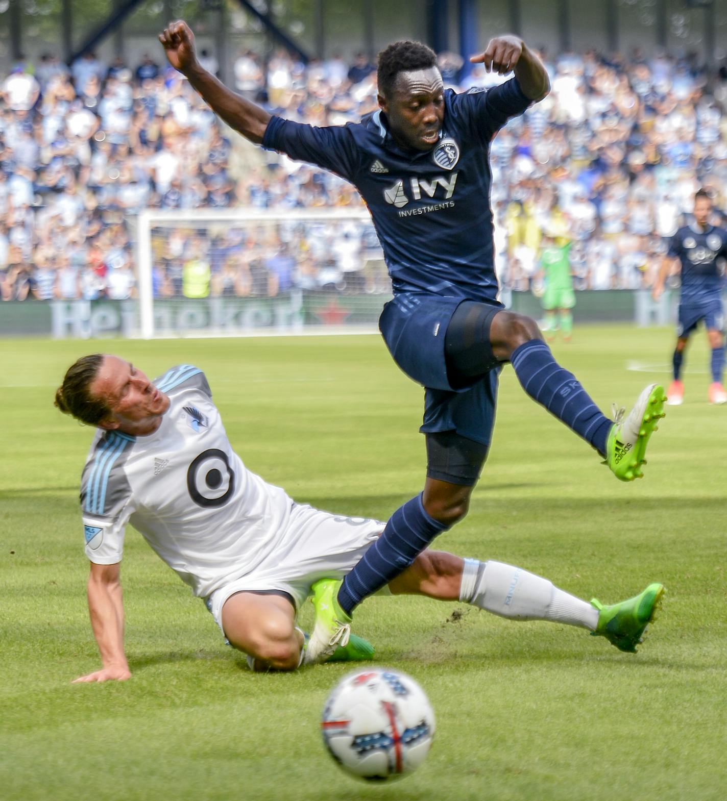 Sporting Kansas City forward Gerso Fernandes (7) got the ball away from Minnesota United midfielder Mohammed Saeid (8) on Saturday during the first half of the MLS soccer match against at Children&#xed;s Mercy Park in Kansas City, Kan. Sporting Kansas City won 3-0. ORG XMIT: B7310202769Z.1 (Allison Long, Kansas City Star)