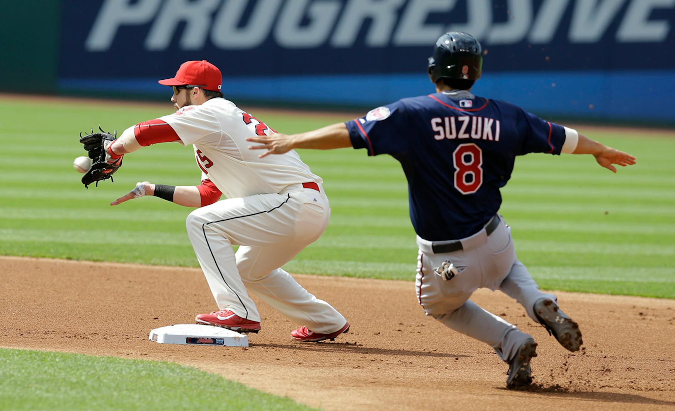 Cleveland Indiansí Jason Kipnis gets Minnesota Twins' Kurt Suzuki, right, out at second base in the first inning of a baseball game, Saturday, May 9, 2015, in Cleveland. Twins' Eduardo Escobar grounded in to a fielder's choice.