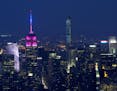 The Empire State Building, left, and 432 Park Ave., center, dominate the midtown Manhattan skyline, Saturday, July 4, 2015 in New York in a view from 