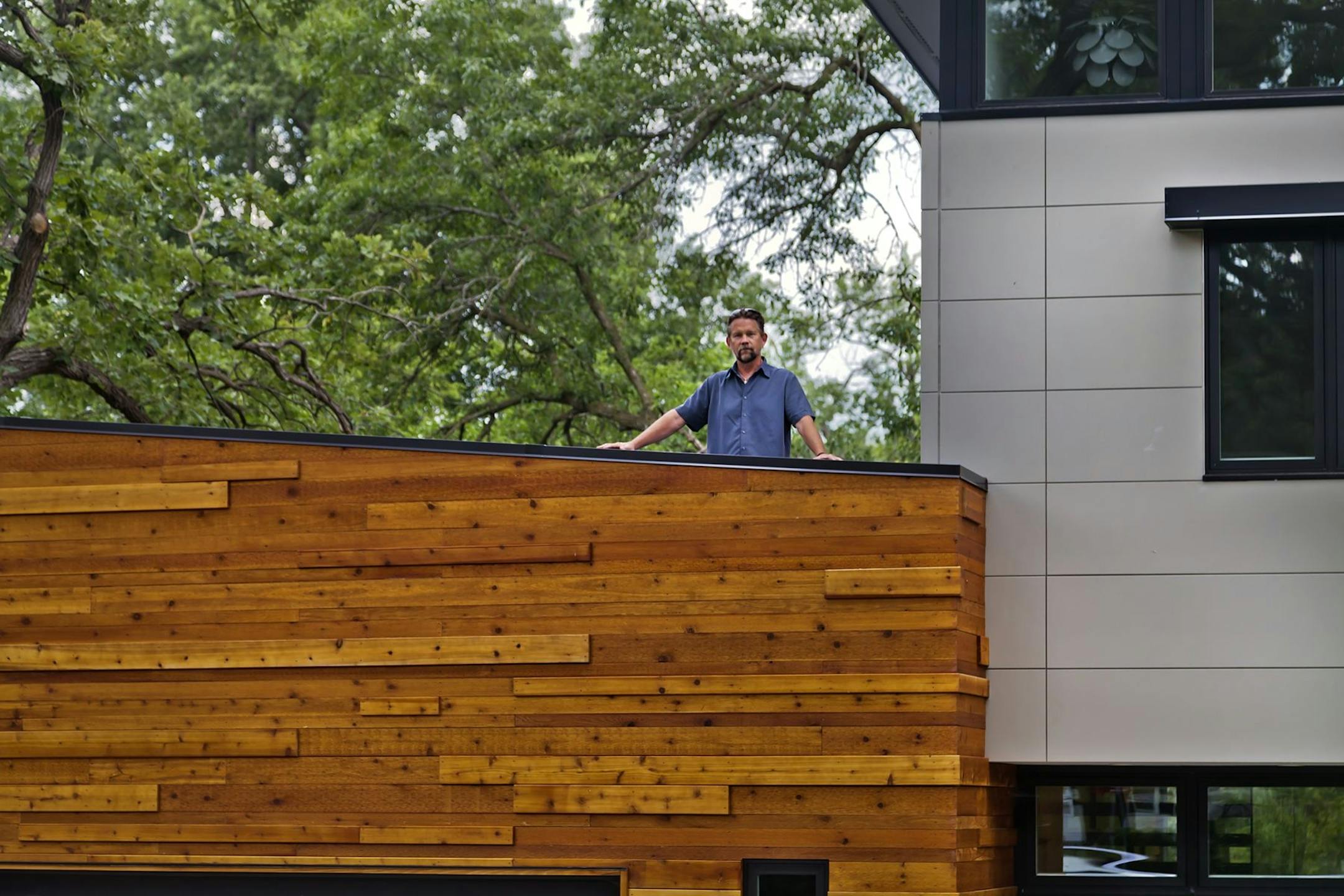 Architect Michael Roehr on the rooftop deck. Credit Gilbertson Photography