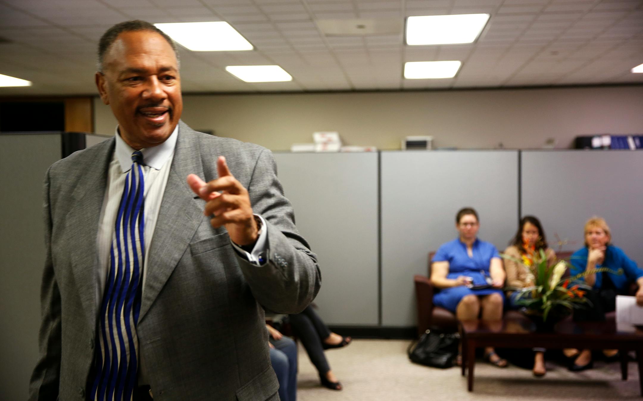 Community Action of Minneapolis CEO Bill Davis ushers the media out of their office during a raid by state officials on Friday, September 26, 2014. ] LEILA NAVIDI leila.navidi@startribune.com /