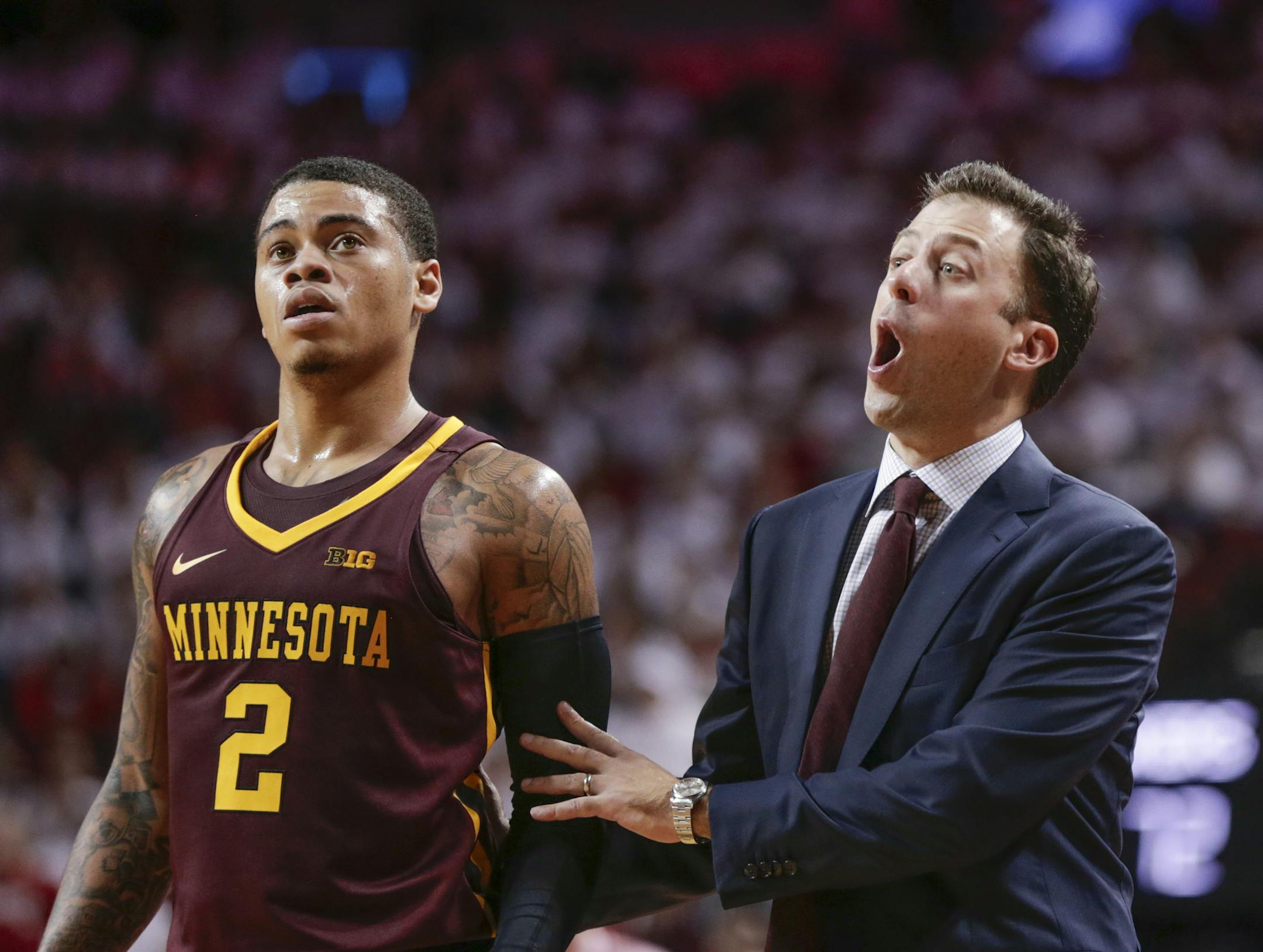 Minnesota coach Richard Pitino talks to his players, including Nate Mason, during the second half of an NCAA college basketball game against Nebraska in Lincoln, Neb., Tuesday, Dec. 5, 2017. Nebraska won 78-68. (AP Photo/Nati Harnik)