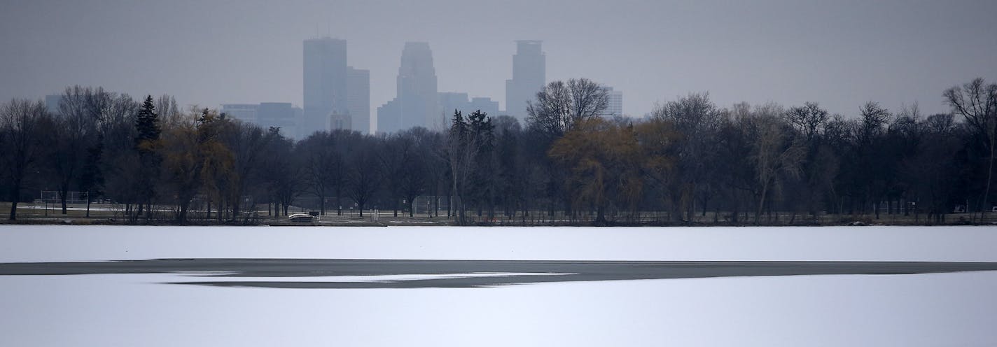 Lake Nokomis in Minneapolis on Tuesday afternoon. The unseasonably warm weather in the State of Hockey has forced the U.S. pond hockey championship organizers to reschedule the event on Lake Nokomis because they fear the ice won't be safe for skating. ] CARLOS GONZALEZ &#xef; cgonzalez@startribune.com - December 22, 2015, Minneapolis, MN, Lake Nokomis, Pond Hockey Championships pushed back because of warm weather.