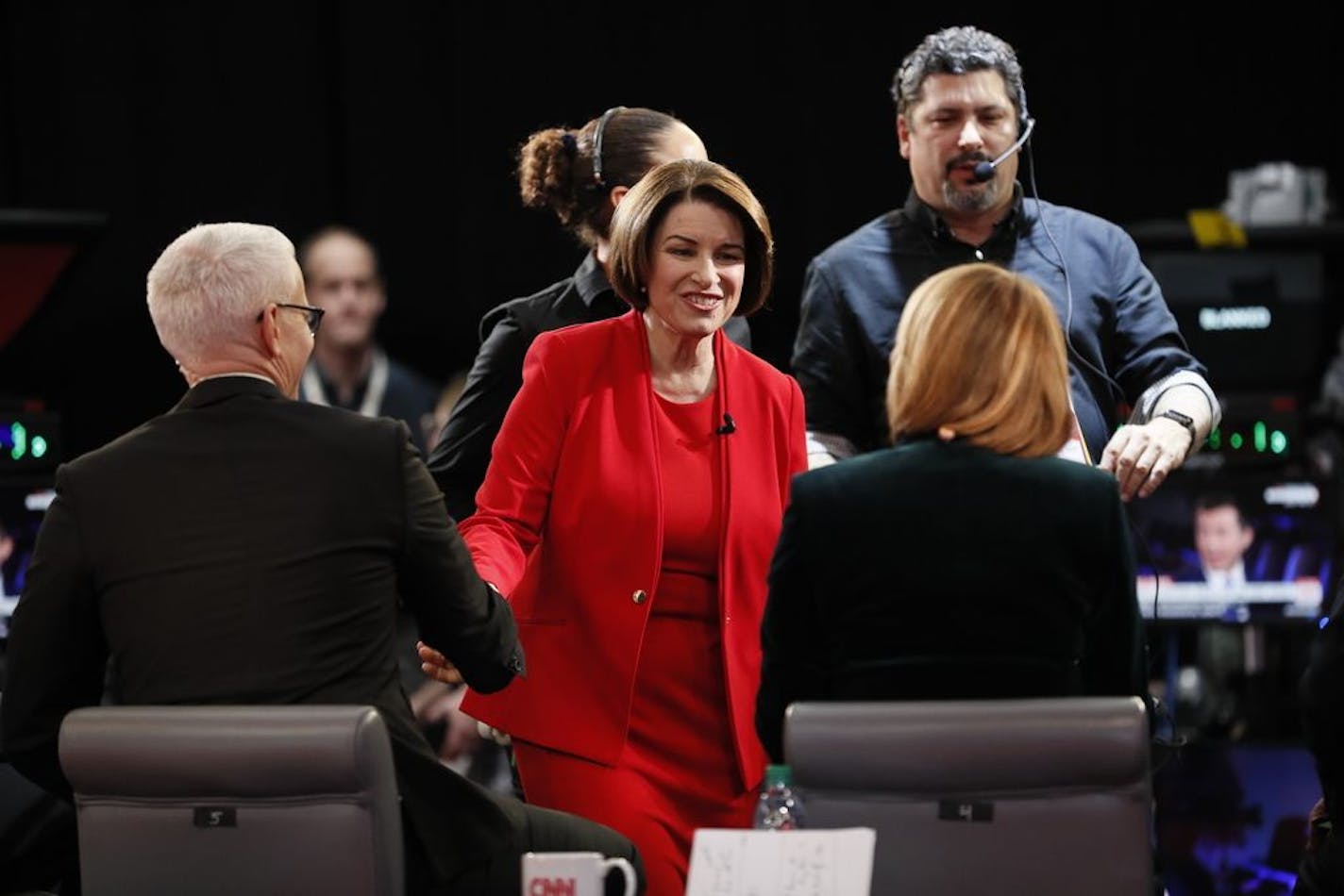 Democratic presidential candidate Sen. Amy Klobuchar, D-Minn., prepares to be interviewed in the spin room Tuesday, Jan. 14, 2020, after a Democratic presidential primary debate hosted by CNN and the Des Moines Register in Des Moines, Iowa.