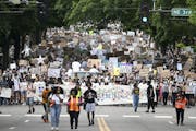 Thousands of protesters marched to Mayor Jacob Frey's house in northeast Minneapolis on Saturday, June 6, to demand the city defund the Police Departm