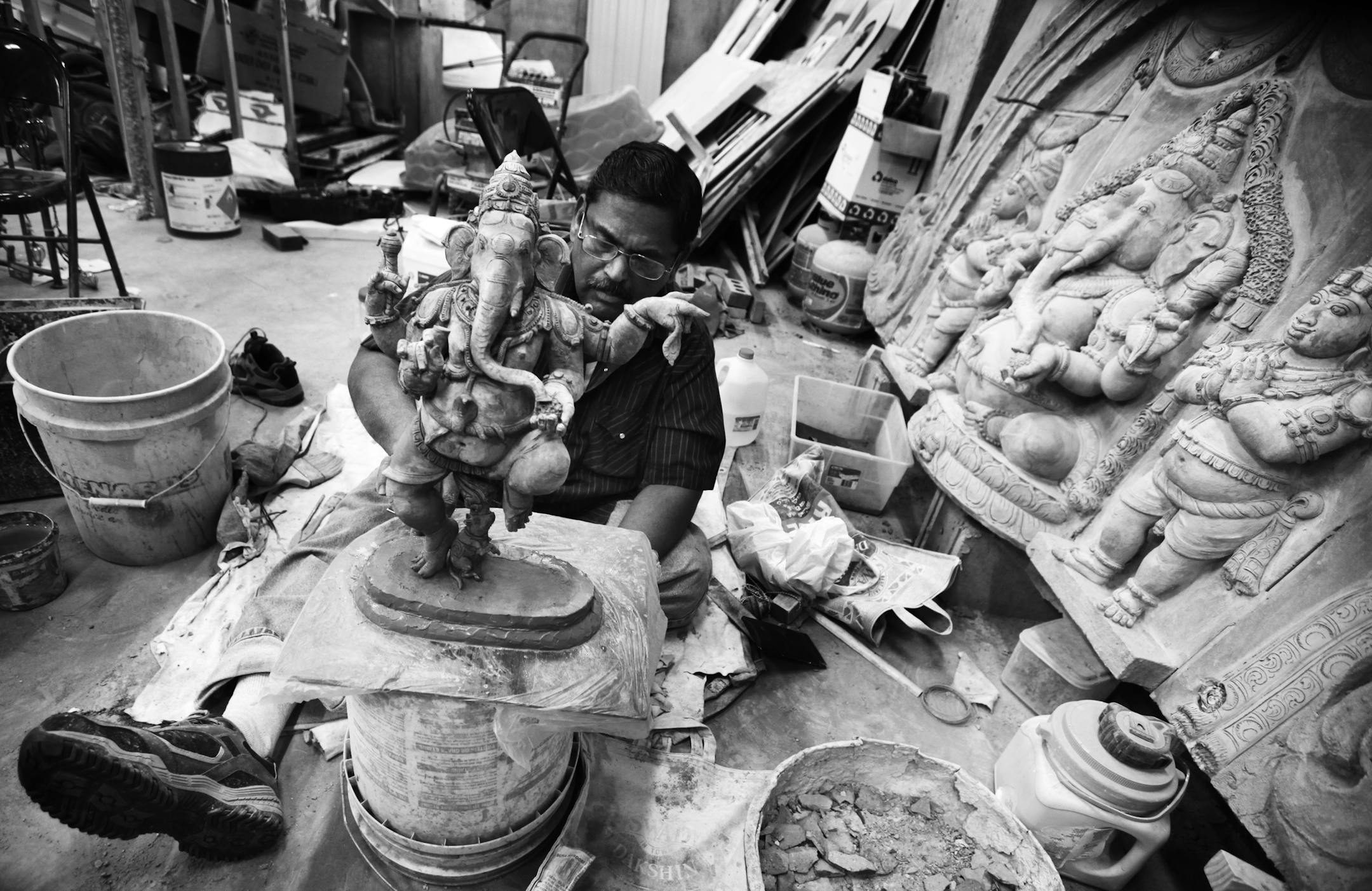 Vairavan C. Achari is a artist/sculptor of Hindu art and has been working the past two years creating art at the Hindu Temple of Minnesota in Maple Grove. Achari, 52, inherited his profession from his father when he was 12 years old. Here, he worked on the deity Lord Ganapathi - the dancing elephant in which Hindus pray to for success before taking up special projects - making the piece from brick pieces and cement from memory, with no visual aid. Achari said "he is proud to be a temple artist.