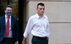 Igor Danchenko leaves Albert V. Bryan United States Courthouse in Alexandria, Va., Nov. 4. Danchenko, a Russian analyst who contributed to a dossier o