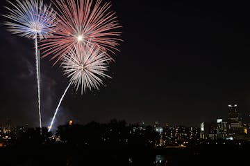 Fireworks were displayed over the Mississippi River in Minneapolis, Minn., on Saturday July 4, 2015. The fireworks were part of the "Red, White & Boom