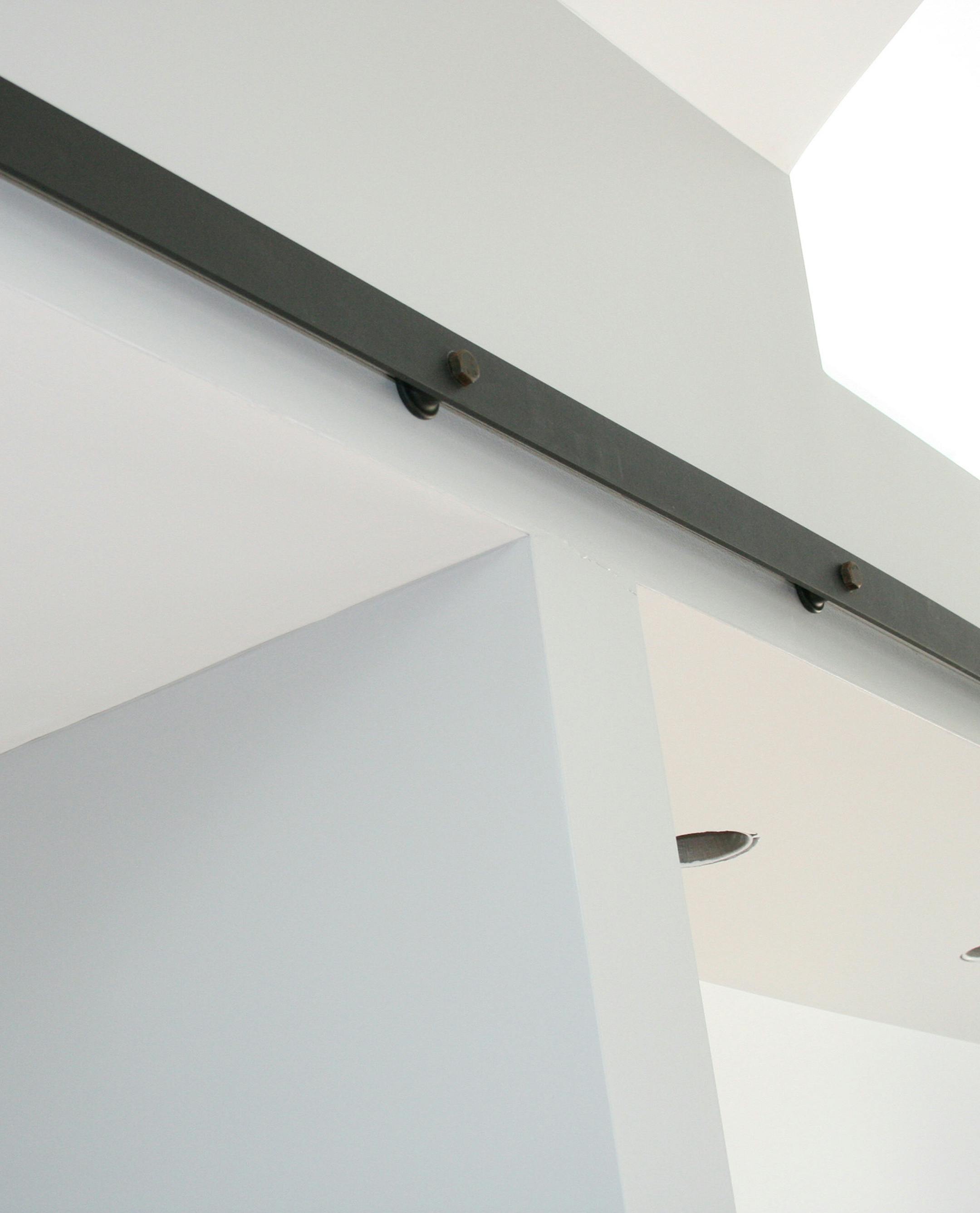 Steel railing with stoppers to hang sliding barn doors and control direction. (Handout/TNS) ORG XMIT: 1176499