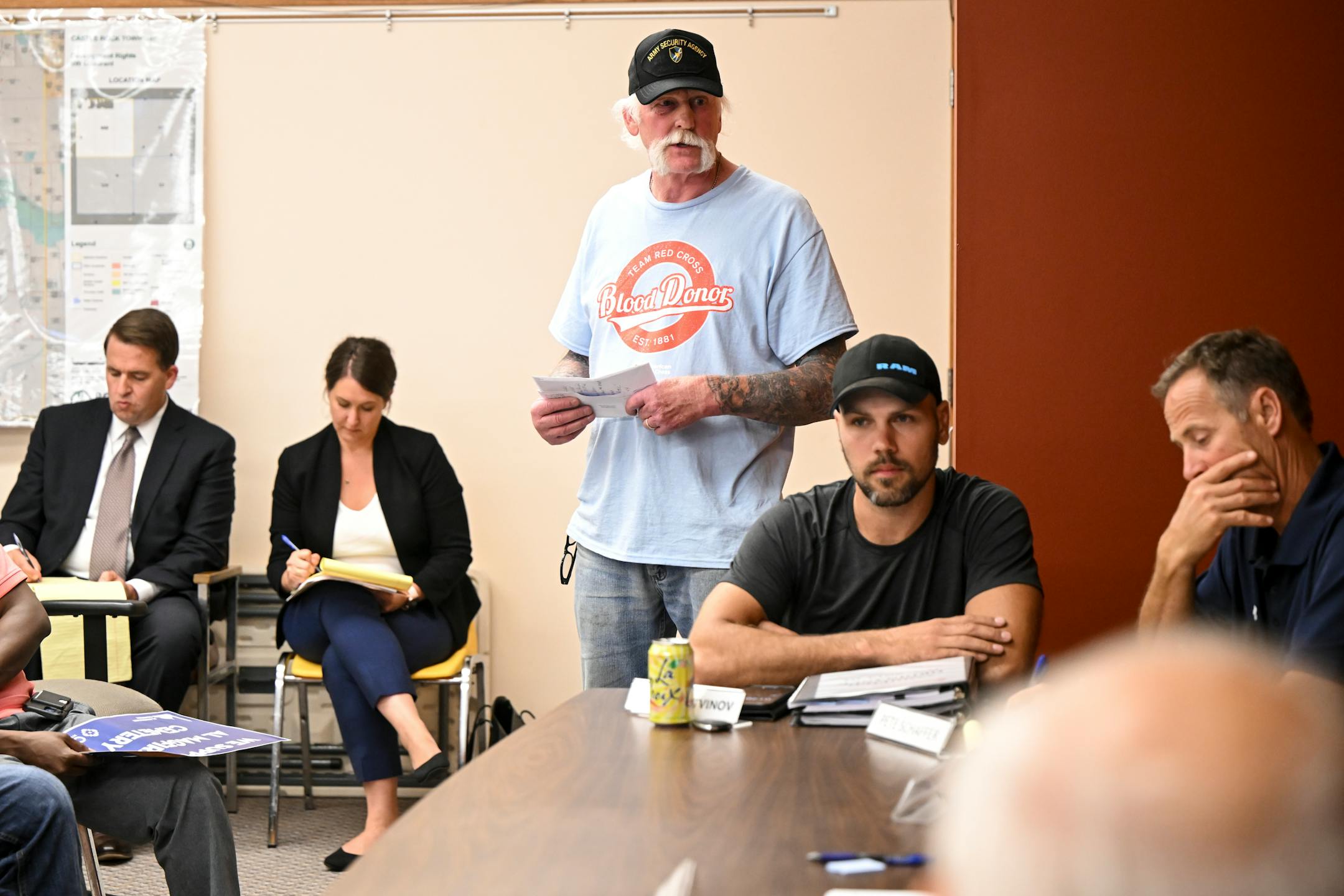 Edward Siegfried, center, raised concerns about the proximity of his property to the proposed cemetery and the possibility of contaminated groundwater during a public hearing.
