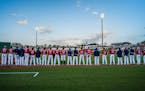 Twins players lined up for the National Anthem.