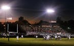 Jim Gehrz/Minneapolis Star Tribune Delano/October 2, 2004/7:30 PM The stadium at Delano High School is aglow beneath lights and a setting sun during t