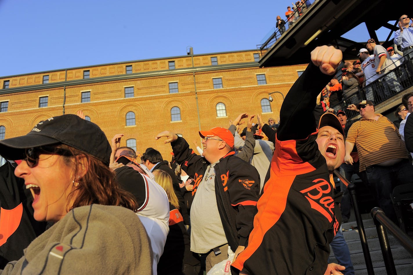 Baltimore Orioles fans erupt as first baseman Chris Davis connects on a grand slam home run in the eighth inning against the Minnesota Twins at Oriole Park at Camden Yards in Baltimore, Maryland, Friday, April 5, 2013. The Orioles defeated the Twins, 9-5.