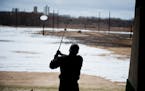 A retiree watches his golf shot at a Chaska driving range in 2013.