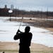 A retiree watches his golf shot at a Chaska driving range in 2013.