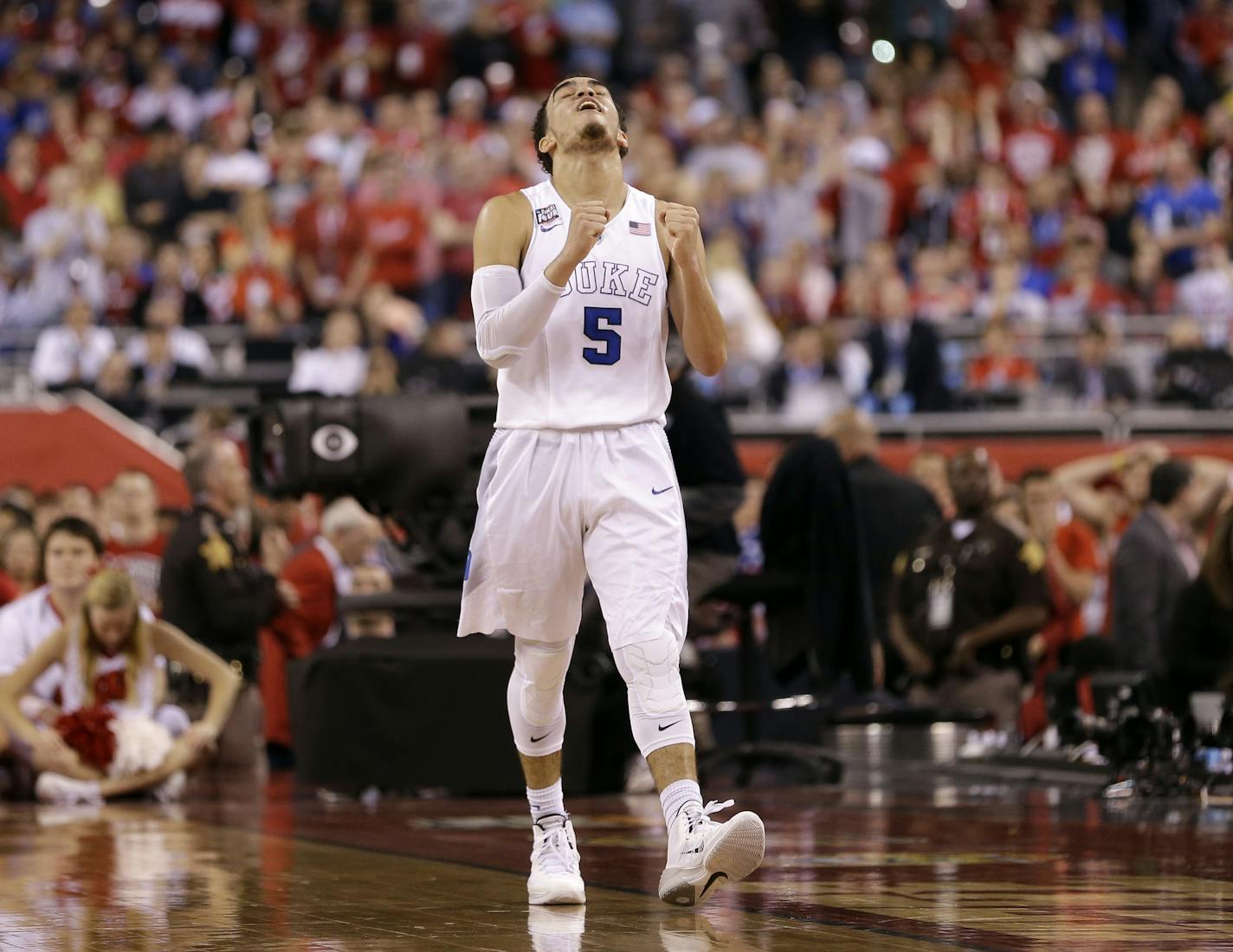 Duke's Tyus Jones reacts during the second half of the NCAA Final Four college basketball tournament championship game against Wisconsin Monday, April 6, 2015, in Indianapolis. Duke won 68-63. (AP Photo/David J. Phillip) ORG XMIT: FF245