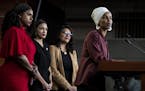 U.S. Reps. Ayanna Pressley, Alexandria Ocasio-Cortez and Rashida Tlaib listened as Rep. Ilhan Omar responded to remarks by President Donald Trump afte