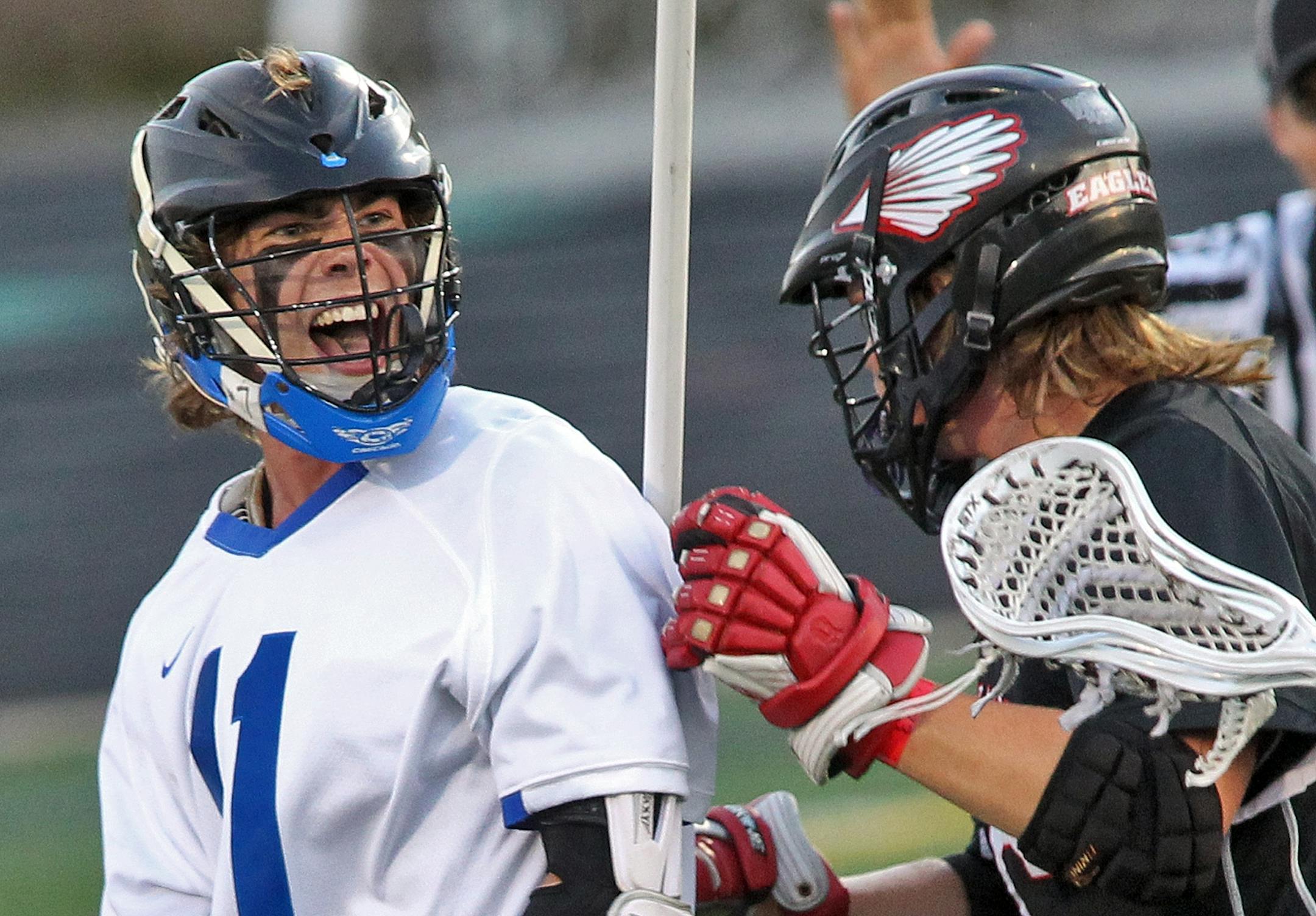 State high school boys lacrosse finals. Eastview vs. Eden Prairie. Eastview's Jacob Heppner, left, celebrated after he scored a first qurter goal. Eastview led 4-1 after one quarter of play. (MARLIN LEVISON/STARTRIBUNE(mlevison@startribune.com