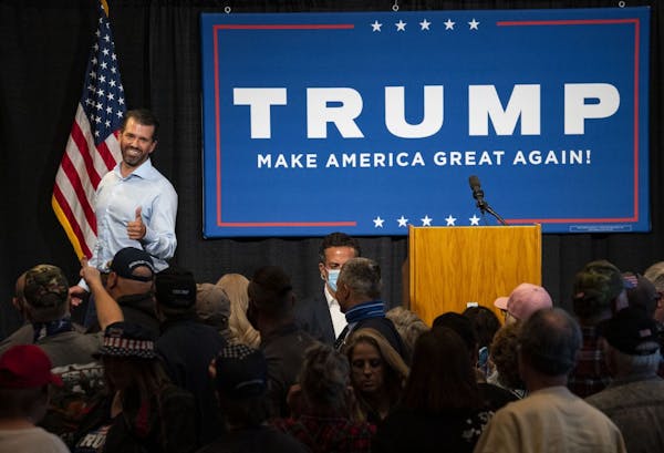 Donald Trump Jr. smiled and gave a thumbs up to supporters at the conclusion of his campaign event at the DECC in Duluth on Wednesday.